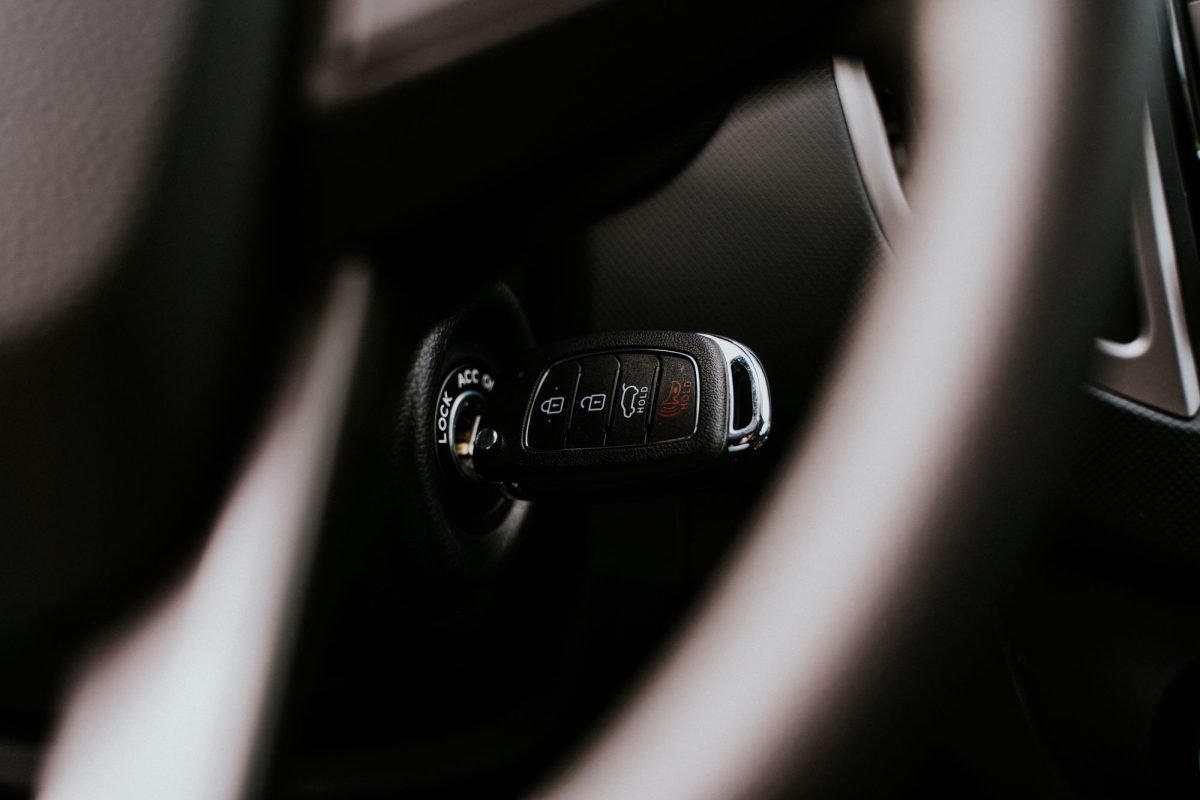 A car key in the ignition inside a vehicle