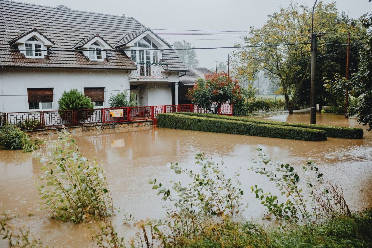 A suburban house surrounded by floodwaters after heavy rain