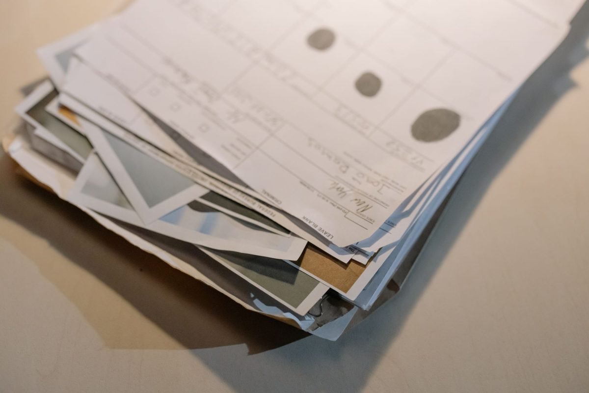 Close-up of a stack of papers and documents on a desk