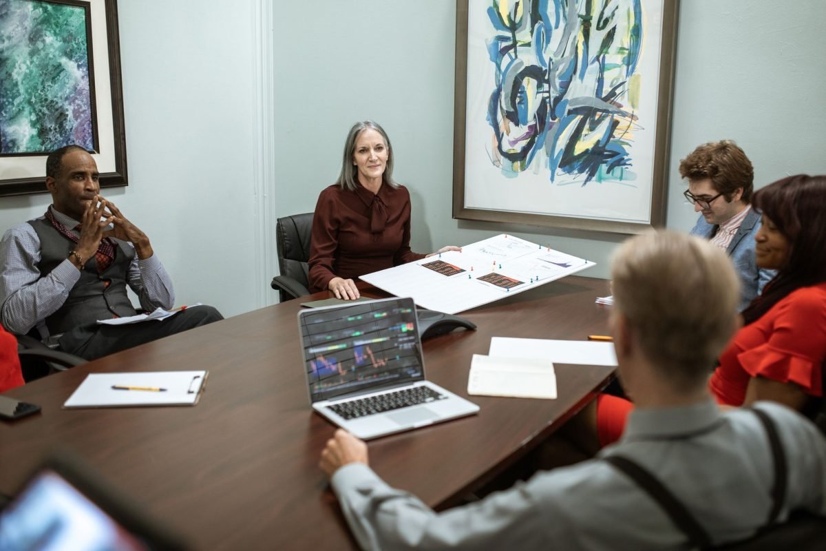 A group of professionals meeting around a conference table