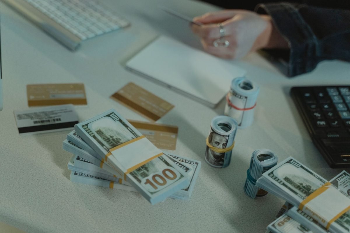 Rolled cash and credit cards on a table