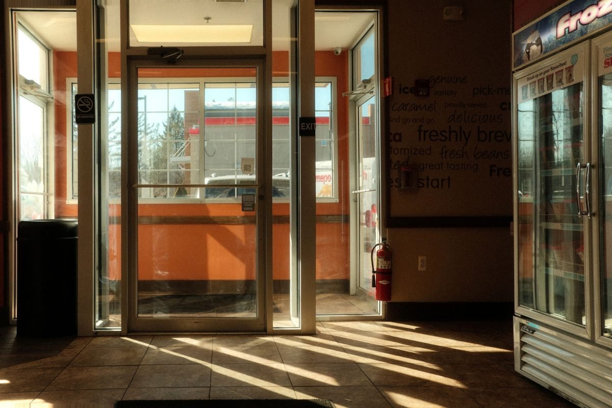 Sunlit entrance of a convenience store in Suffern, New York